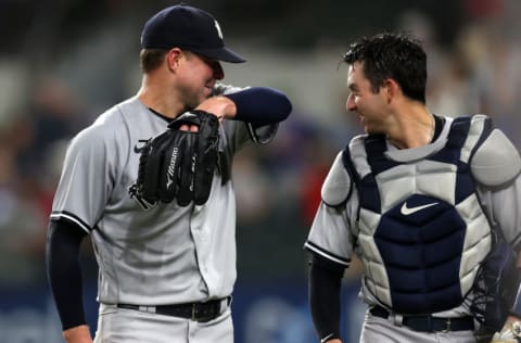 ARLINGTON, TEXAS - MAY 19: Corey Kluber #28 of the New York Yankees celebrates a no-hitter with Kyle Higashioka #66 against the Texas Rangers at Globe Life Field on May 19, 2021 in Arlington, Texas. (Photo by Ronald Martinez/Getty Images)