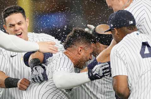 NEW YORK, NEW YORK - MAY 21: Aaron Judge #99, Miguel Andujar #41, and Gio Urshela #29 celebrate with Gleyber Torres #25 of the New York Yankees (Photo by Sarah Stier/Getty Images)