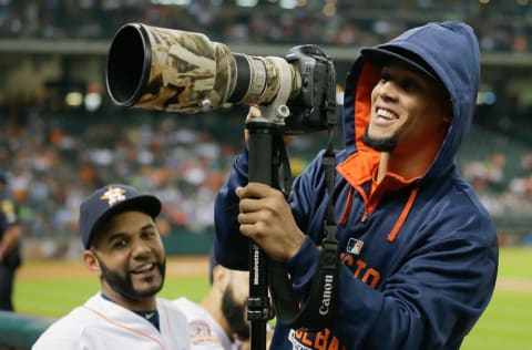 HOUSTON, TX - SEPTEMBER 21: Carlos Gomez #30 of the Houston Astros takes a photographers camera and looks in the crowd at Minute Maid Park on September 21, 2015 in Houston, Texas. (Photo by Bob Levey/Getty Images)