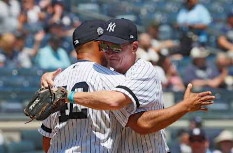 NEW YORK, NY - JUNE 23: Former Yankees pitcher Mariano Rivera, who will be inducted into the Baseball Hall of Fame this year, gets a hug from Old Timer David Cone during Old Timer's Day festivities before an MLB baseball game between the New York Yankees and Houston Astros on June 23, 2019 at Yankee Stadium in the Bronx borough of New York City. (Photo by Paul Bereswill/Getty Images)