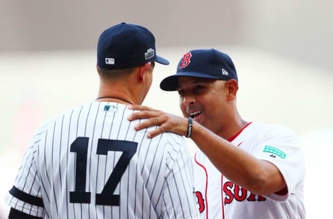 LONDON, ENGLAND - JUNE 29: Aaron Boone #17 manager of the New York Yankees speaks with Alex Cora #20 manager of the Boston Red Sox before the MLB London Series game between Boston Red Sox and New York Yankees at London Stadium on June 29, 2019 in London, England. (Photo by Dan Istitene - Pool/Getty Images)