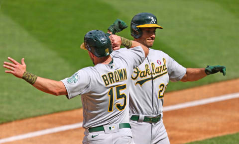 Matt Olson #28 and Seth Brown #15 of the Oakland Athletics (Photo by Adam Bettcher/Getty Images)