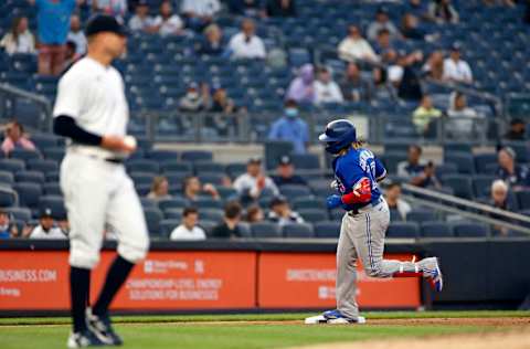 NEW YORK, NY - MAY 25: Vladimir Guerrero Jr. #27 of the Toronto Blue Jays rounds third base after hitting a two-run home run off of Corey Kluber #28 of the New York Yankees during the third inning at Yankee Stadium on May 25, 2021 in the Bronx borough of New York City. (Photo by Adam Hunger/Getty Images)