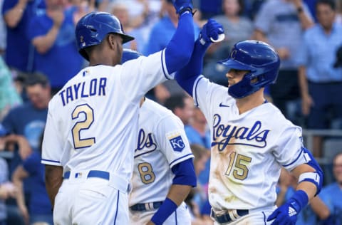 KANSAS CITY, MO - JUNE 04: Whit Merrifield #15 of the Kansas City Royals celebrates with Michael A. Taylor #2 after scoring against the Minnesota Twins at Kauffman Stadium on June 4, 2021 in Kansas City, Missouri. (Photo by Kyle Rivas/Getty Images)