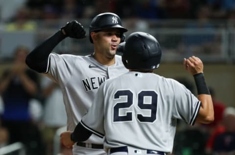 MINNEAPOLIS, MN - JUNE 8: Gio Urshela #29 of the New York Yankees congratulates Gary Sanchez #24 on a two-run home run against the Minnesota Twins in the ninth inning of the game at Target Field on June 8, 2021 in Minneapolis, Minnesota. The Yankees defeated the Twins 8-4. (Photo by David Berding/Getty Images)