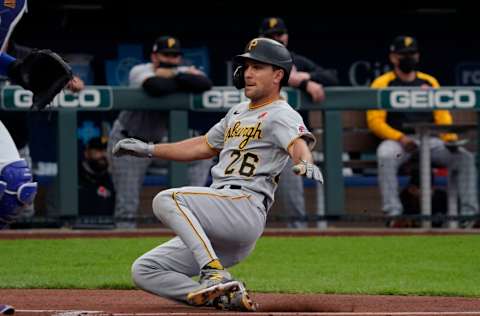 KANSAS CITY, MISSOURI - MAY 31: Adam Frazier #26 of the Pittsburgh Pirates scores in the first inning against the Kansas City Royals at Kauffman Stadium on May 31, 2021 in Kansas City, Missouri. (Photo by Ed Zurga/Getty Images)