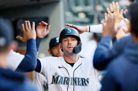 SEATTLE, WASHINGTON - JUNE 01: Mitch Haniger #17 of the Seattle Mariners reacts after he scored a run after a double by Kyle Seager #15 during the third inning against the Oakland Athletics at T-Mobile Park on June 01, 2021 in Seattle, Washington. (Photo by Steph Chambers/Getty Images)