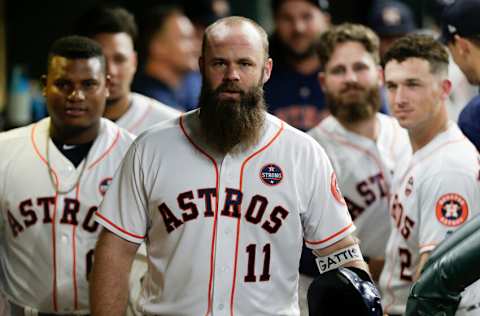 HOUSTON, TX - SEPTEMBER 05: Evan Gattis #11 of the Houston Astros celebrates his two-run home run in the fourth inning against the Minnesota Twins with his teammates in the dugout at Minute Maid Park on September 5, 2018 in Houston, Texas. (Photo by Bob Levey/Getty Images)