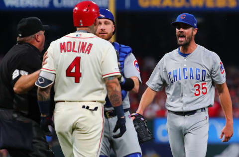 ST LOUIS, MO - SEPTEMBER 28: Jonathan Lucroy #25 of the Chicago Cubs restrains Yadier Molina #4 of the St. Louis Cardinals as he confronts Cole Hamels #35 of the Chicago Cubs after he hit Molina with a pitch in the second inning at Busch Stadium on September 28, 2019 in St Louis, Missouri. (Photo by Dilip Vishwanat/Getty Images)