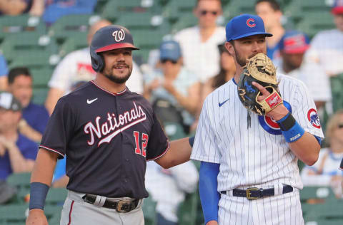 CHICAGO, ILLINOIS - MAY 19: Former teammates Kyle Schwarber #12 of the Washington Nationals and Kris Bryant #17 of the Chicago Cubs chat at first base after Schwarber drew a walk in the 2nd inning at Wrigley Field on May 19, 2021 in Chicago, Illinois. (Photo by Jonathan Daniel/Getty Images)