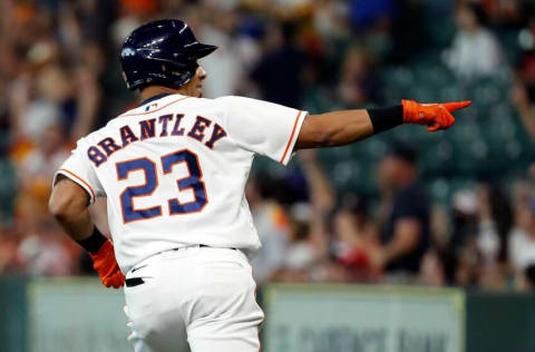 HOUSTON, TEXAS - JUNE 17: Michael Brantley #23 of the Houston Astros hits a three-run home run in the first inning against the Chicago White Sox at Minute Maid Park on June 17, 2021 in Houston, Texas. (Photo by Bob Levey/Getty Images)