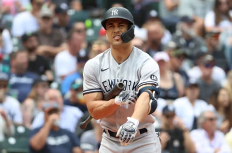 SEATTLE, WASHINGTON - JULY 08: Giancarlo Stanton #27 of the New York Yankees reacts while at bat during the fourth inning against the Seattle Mariners at T-Mobile Park on July 08, 2021 in Seattle, Washington. (Photo by Abbie Parr/Getty Images)