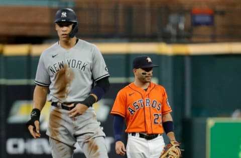 HOUSTON, TEXAS - JULY 09: Aaron Judge #99 of the New York Yankees stands on second base while Jose Altuve #27 of the Houston Astros looks on at Minute Maid Park on July 09, 2021 in Houston, Texas. (Photo by Bob Levey/Getty Images)