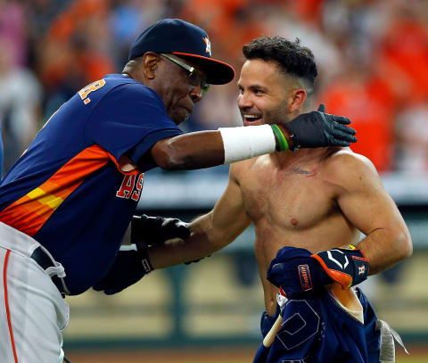 Manager Dusty Baker Jr. #12 of the Houston Astros hugs Jose Altuve (Photo by Bob Levey/Getty Images)