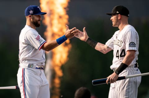 DENVER, COLORADO - JULY 12: American League All-Star Joey Gallo #13 of the Texas Rangers and Trevor Story #27 of the Colorado Rockies (both wearing #44 in honor of Hank Aaron) high five during the 2021 T-Mobile Home Run Derby at Coors Field on July 12, 2021 in Denver, Colorado. (Photo by Matt Dirksen/Colorado Rockies/Getty Images)