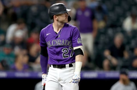 DENVER, COLORADO - JULY 20: Trevor Story #27 of the Colorado Rockies strikes out to end the ninth inning in their loss against the Seattle Mariners at Coors Field on July 20, 2021 in Denver, Colorado. (Photo by Matthew Stockman/Getty Images)