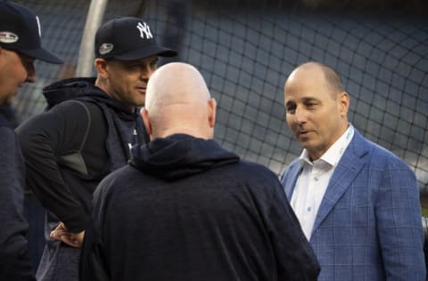 NEW YORK, NY - OCTOBER 09: Manager Aaron Boone and general manager Brian Cashman of the New York Yankees ahead of game four of the MLB American League Divisional Series at Yankees Stadium on October 9 2018 in the Bronx borough of New York City. (Photo by Benjamin Solomon/Getty Images)