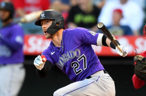 ANAHEIM, CA - JULY 28: Trevor Story #27 of the Colorado Rockies hits a two run home run in the first inning of the game against the Los Angeles Angels at Angel Stadium of Anaheim on July 28, 2021 in Anaheim, California. (Photo by Jayne Kamin-Oncea/Getty Images)