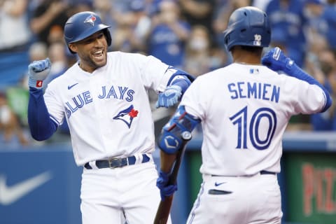 TORONTO, ON – AUGUST 04: George Springer #4 of the Toronto Blue Jays and Marcus Semien #10 celebrate Springer’s home run in the first inning of their MLB game against the Cleveland Indians at Rogers Centre on August 4, 2021 in Toronto, Ontario. (Photo by Cole Burston/Getty Images)