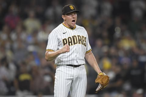 SAN DIEGO, CA – AUGUST 10: Mark Melancon #33 of the San Diego Padres reacts after a 6-5 win over the Miami Marlins at Petco Park on August 10, 2021 in San Diego, California. (Photo by Denis Poroy/Getty Images)