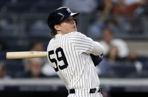 NEW YORK, NY - AUGUST 17: Luke Voit #59 of the New York Yankees hits a home run against the Boston Red Sox in the second inning during game two of a doubleheader at Yankee Stadium on August 17, 2021 in New York City. (Photo by Adam Hunger/Getty Images)