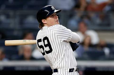 NEW YORK, NY - AUGUST 17: Luke Voit #59 of the New York Yankees hits a home run against the Boston Red Sox in the second inning during game two of a doubleheader at Yankee Stadium on August 17, 2021 in New York City. (Photo by Adam Hunger/Getty Images)