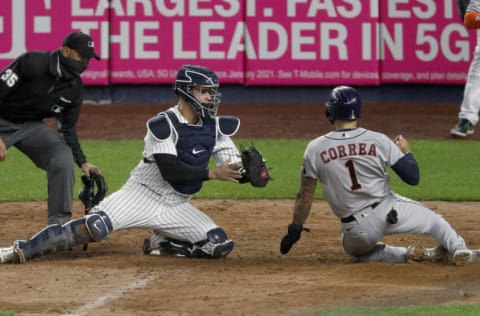 NEW YORK, NEW YORK - MAY 05: (NEW YORK DAILIES OUT) Gary Sanchez #24 of the New York Yankees tags out Carlos Correa #1 of the Houston Astros during the fourth inning at Yankee Stadium on May 05, 2021 in New York City. The Yankees defeated the Astros 6-3. (Photo by Jim McIsaac/Getty Images)