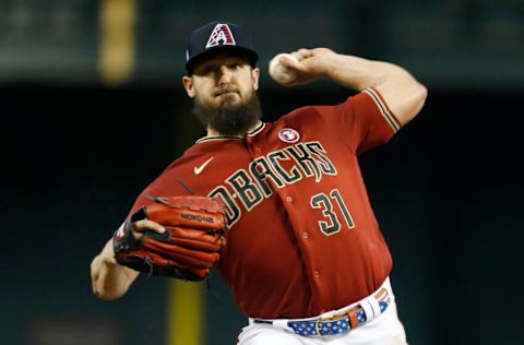 PHOENIX, ARIZONA - JULY 04: Starting pitcher Caleb Smith #31 of the Arizona Diamondbacks throws against the San Francisco Giants during the second inning of the MLB game at Chase Field on July 04, 2021 in Phoenix, Arizona. (Photo by Ralph Freso/Getty Images)