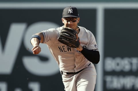 BOSTON, MA - JULY 24: Gleyber Torres #25 of the New York Yankees throws out a runner during the fourth inning at Fenway Park on July 24, 2021 in Boston, Massachusetts. (Photo By Winslow Townson/Getty Images)