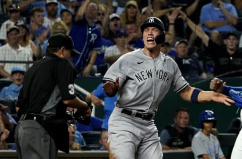 KANSAS CITY, MISSOURI - AUGUST 09: Aaron Judge #99 of the New York Yankees reacts after being called out by umpire Brian Knight at the plate in the seventh inning against the Kansas City Royals at Kauffman Stadium on August 09, 2021 in Kansas City, Missouri. Judge tried to score on a fielder's choice on the play. (Photo by Ed Zurga/Getty Images)