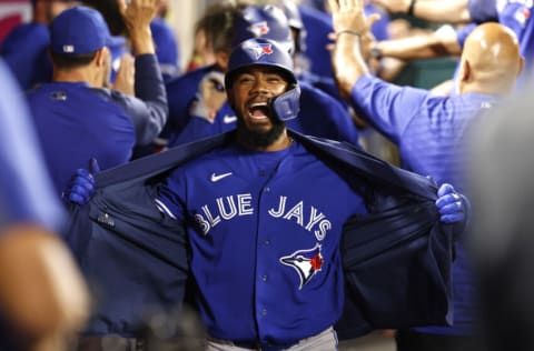 ANAHEIM, CALIFORNIA - AUGUST 11: Teoscar Hernandez #37 of the Toronto Blue Jays celebrates in the dugout after hitting a grand slam against the Los Angeles Angels during the fifth inning at Angel Stadium of Anaheim on August 11, 2021 in Anaheim, California. (Photo by Michael Owens/Getty Images)