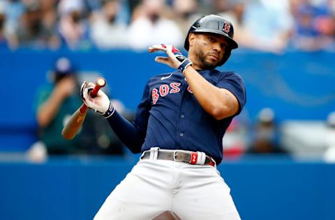 TORONTO, ON - AUGUST 08: Xander Bogaerts #2 of the Boston Red Sox evades an inside pitch during a MLB game against the Toronto Blue Jays at Rogers Centre on August 08, 2021 in Toronto, Canada. (Photo by Vaughn Ridley/Getty Images)