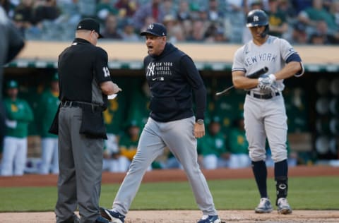 OAKLAND, CALIFORNIA - AUGUST 26: Manager Aaron Boone #17 of the New York Yankees reacts after being ejected from the game against the Oakland Athletics by home plate umpire Todd Tichenor #13 in the top of the second inning at RingCentral Coliseum on August 26, 2021 in Oakland, California. (Photo by Lachlan Cunningham/Getty Images)