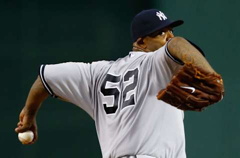 BOSTON, MA - JULY 21: CC Sabathia #52 of the New York Yankees pitches against the Boston Red Sox during the game on July 21, 2013 at Fenway Park in Boston, Massachusetts. (Photo by Jared Wickerham/Getty Images)