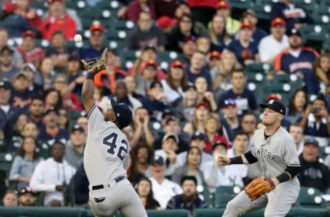 DETROIT, MI - JUNE 4: Third baseman Miguel Andujar #41 of the New York Yankees closes in on a fly ball hit by Jeimer Candelario of the Detroit Tigers but can't make the catch as Clint Frazier #77 of the New York Yankees, right, backs up on the play during the fourth inning of game two of a doubleheader at Comerica Park on June 4, 2018 in Detroit, Michigan. Candelario doubled on the play. Players on both teams are wearing the number 42 to celebrate Jackie Robinson Day, as it is the makeup of the game rained out on April 15. (Photo by Duane Burleson/Getty Images)