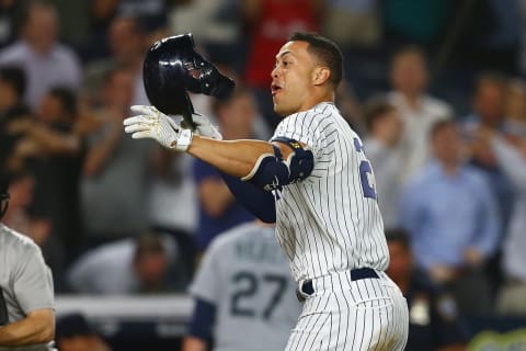 NEW YORK, NY – JUNE 20: Giancarlo Stanton #27 of the New York Yankees celebrates after hitting a walk-off 2-run home run in the bottom of the ninth inning against the Seattle Mariners at Yankee Stadium on June 20, 2018 in the Bronx borough of New York City. New York Yankees defeated the Seattle Mariners 7-5. (Photo by Mike Stobe/Getty Images)