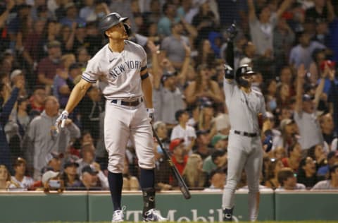 BOSTON, MA - SEPTEMBER 25: Giancarlo Stanton #27 of the New York Yankees connects for a grand slam home run against the Boston Red Sox in the eighth inning at Fenway Park on September 25, 2021 in Boston, Massachusetts. (Photo by Jim Rogash/Getty Images)