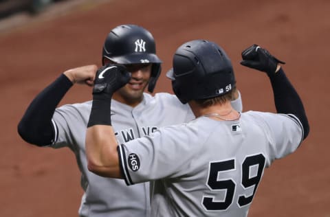 BALTIMORE, MARYLAND - JULY 30: Luke Voit #59 of the New York Yankees celebrates with Gleyber Torres #25 after hitting a first inning grand slam against the Baltimore Orioles at Oriole Park at Camden Yards on July 30, 2020 in Baltimore, Maryland. (Photo by Rob Carr/Getty Images)