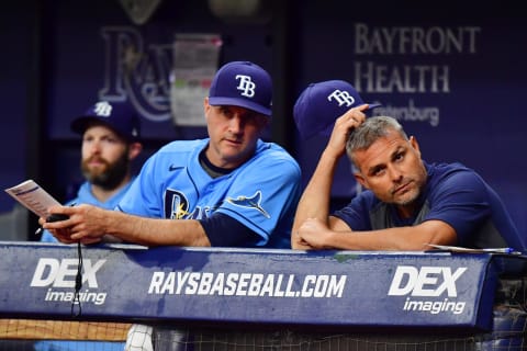 Manager Kevin Cash #16 (right) of the Tampa Bay Rays looks on with Matt Quatraro #33 (Photo by Julio Aguilar/Getty Images)