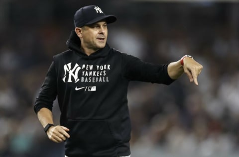 NEW YORK, NY - JULY 17: Aaron Boone #17 of the New York Yankees runs off the field during the first inning against the Boston Red Sox at Yankee Stadium on July 17, 2021 in the Bronx borough of New York City. (Photo by Adam Hunger/Getty Images)