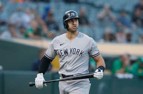 OAKLAND, CALIFORNIA - AUGUST 26: Joey Gallo #13 of the New York Yankees looks on during the game against the Oakland Athletics at RingCentral Coliseum on August 26, 2021 in Oakland, California. (Photo by Lachlan Cunningham/Getty Images)