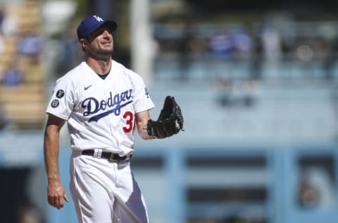 LOS ANGELES, CALIFORNIA - SEPTEMBER 12: Max Scherzer #31 of the Los Angeles Dodgers reacts to fans cheering while going for his 3000th strikeout in the fifth inning against the San Diego Padres at Dodger Stadium on September 12, 2021 in Los Angeles, California. (Photo by Meg Oliphant/Getty Images)