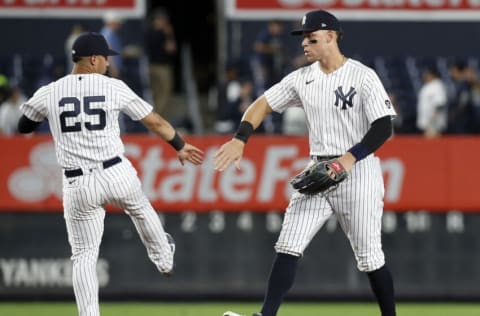 NEW YORK, NEW YORK - SEPTEMBER 20: Aaron Judge #99 and Gleyber Torres #25 of the New York Yankees celebrate after defeating the Texas Rangers at Yankee Stadium on September 20, 2021 in the Bronx borough of New York City. (Photo by Jim McIsaac/Getty Images)