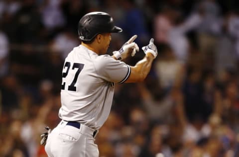 BOSTON, MASSACHUSETTS - SEPTEMBER 26: Giancarlo Stanton #27 of the New York Yankees reacts after hitting a home run in the top of the eighth inning against the Boston Red Sox at Fenway Park on September 26, 2021 in Boston, Massachusetts. (Photo by Omar Rawlings/Getty Images)