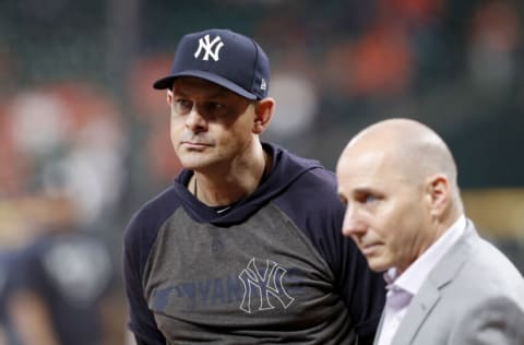 HOUSTON, TX - OCTOBER 13: Manager Aaron Boone #17 of the New York Yankees watches batting practice before game two of the American League Championship Series against the Houston Astros at Minute Maid Park on October 13, 2019 in Houston, Texas. (Photo by Tim Warner/Getty Images)