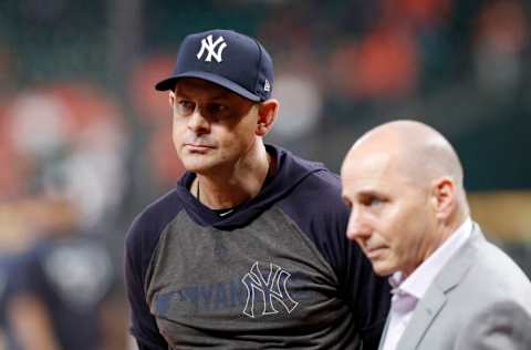 HOUSTON, TX - OCTOBER 13: Manager Aaron Boone #17 of the New York Yankees watches batting practice before game two of the American League Championship Series against the Houston Astros at Minute Maid Park on October 13, 2019 in Houston, Texas. (Photo by Tim Warner/Getty Images)