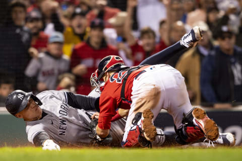 Kevin Plawecki #25 of the Boston Red Sox tags out Aaron Judge #99 of the New York Yankees (Photo by Billie Weiss/Boston Red Sox/Getty Images)