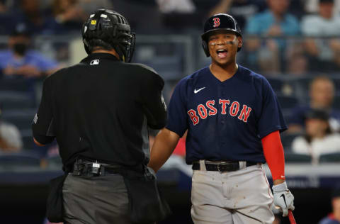 NEW YORK, NY - JULY 18: Rafael Devers #11 of the Boston Red Sox argues a called third strike with home plate umpire Manny Gonzalez #79 during the sixth inning of a game against the New York Yankees at Yankee Stadium on July 18, 2021 in New York City. (Photo by Rich Schultz/Getty Images)