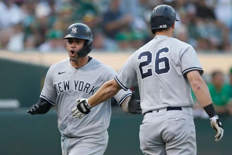 Gary Sanchez #24 of the New York Yankees celebrates with DJ LeMahieu #26 (Photo by Lachlan Cunningham/Getty Images)