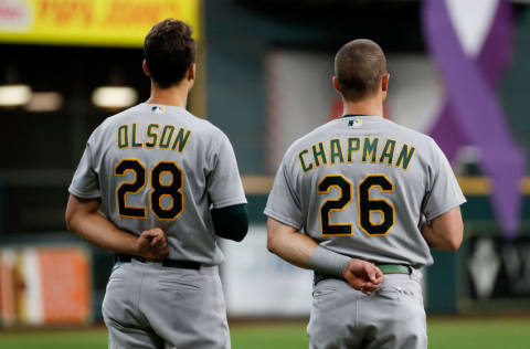 HOUSTON, TEXAS - OCTOBER 02: Matt Olson #28 of the Oakland Athletics and Matt Chapman #26 stand for the National Anthem before the game against the Houston Astros at Minute Maid Park on October 02, 2021 in Houston, Texas. (Photo by Tim Warner/Getty Images)